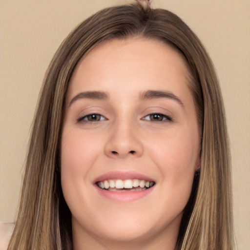 Joyful white young-adult female with long  brown hair and brown eyes