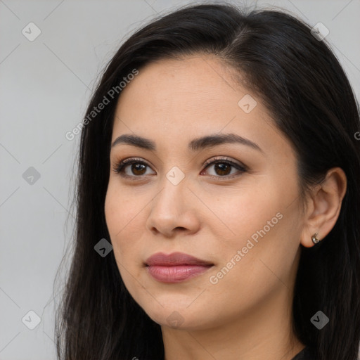 Joyful latino young-adult female with long  brown hair and brown eyes