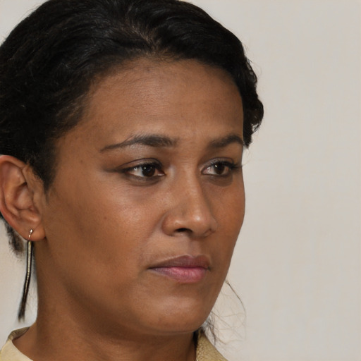 Neutral black young-adult female with short  brown hair and brown eyes