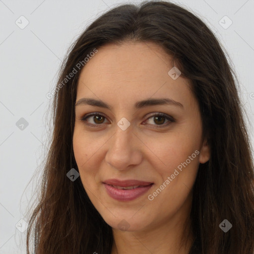 Joyful white adult female with long  brown hair and brown eyes