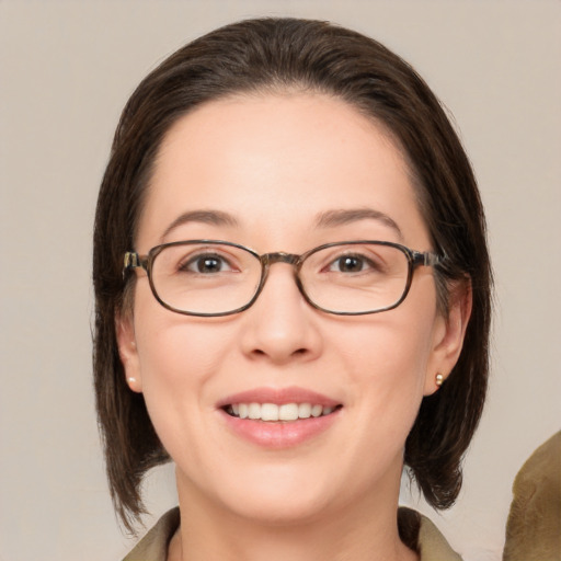 Joyful white young-adult female with medium  brown hair and brown eyes