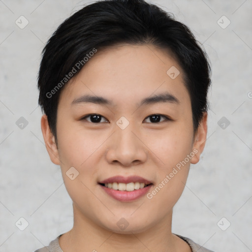 Joyful asian young-adult female with short  black hair and brown eyes