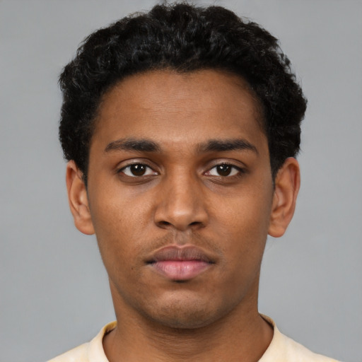 Neutral black young-adult male with short  black hair and brown eyes