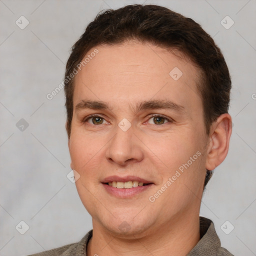 Joyful white adult male with short  brown hair and brown eyes