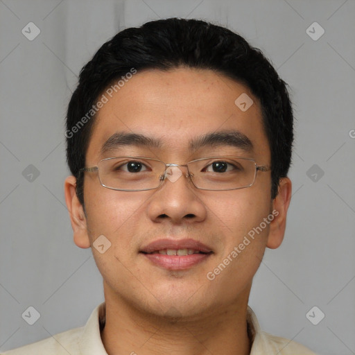 Joyful asian young-adult male with short  black hair and brown eyes