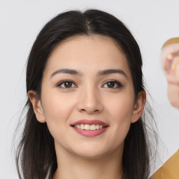 Joyful white young-adult female with medium  brown hair and brown eyes