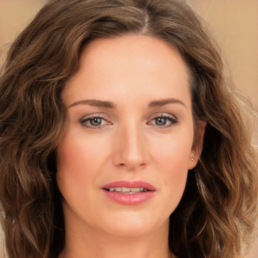 Joyful white young-adult female with long  brown hair and green eyes