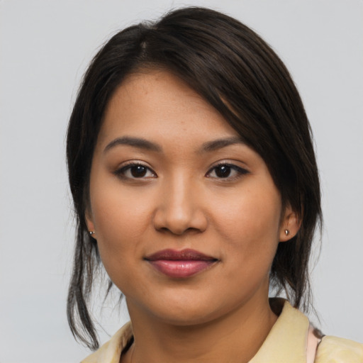 Joyful asian young-adult female with medium  brown hair and brown eyes