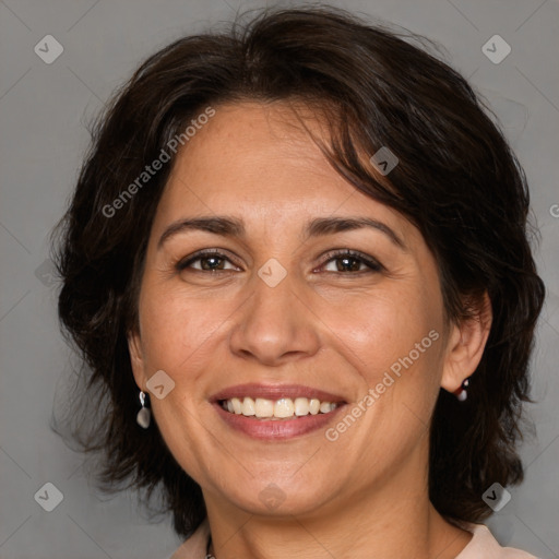 Joyful white adult female with medium  brown hair and brown eyes