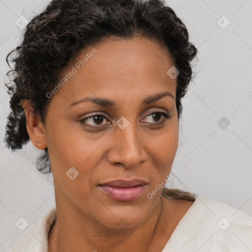 Joyful black adult female with short  brown hair and brown eyes