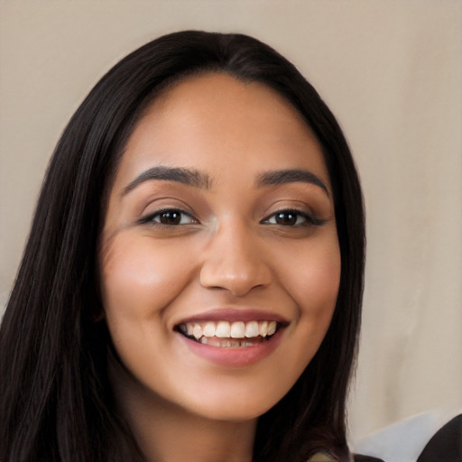 Joyful latino young-adult female with long  black hair and brown eyes