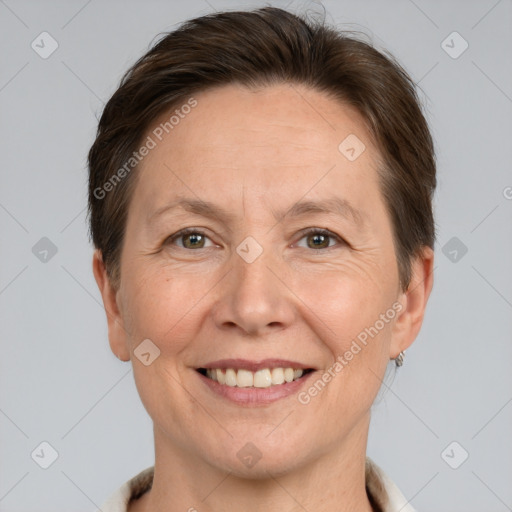 Joyful white adult female with short  brown hair and brown eyes