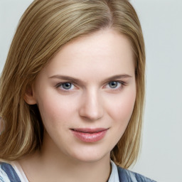 Joyful white young-adult female with long  brown hair and blue eyes