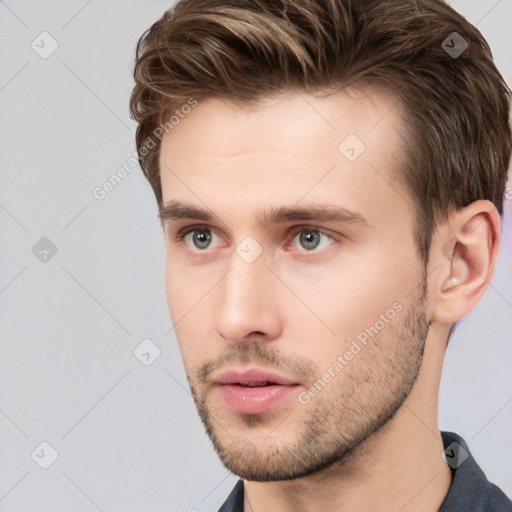 Neutral white young-adult male with short  brown hair and grey eyes