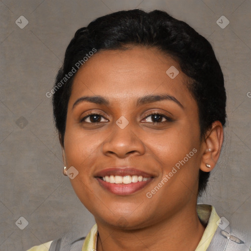 Joyful latino young-adult female with short  black hair and brown eyes