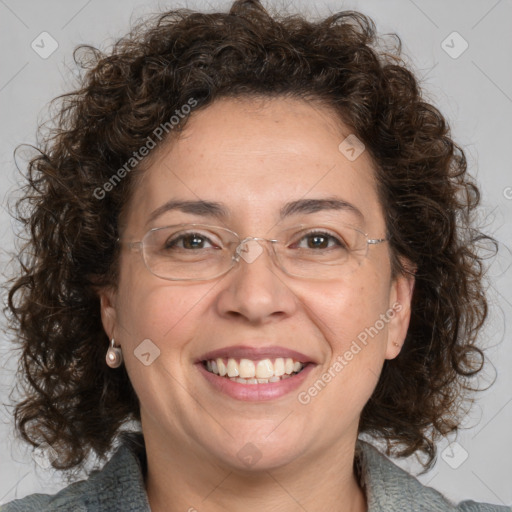 Joyful white adult female with medium  brown hair and blue eyes