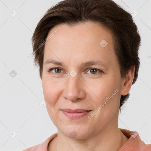 Joyful white adult female with short  brown hair and grey eyes