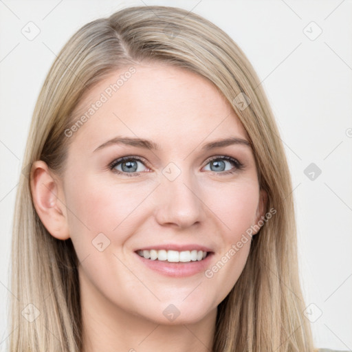 Joyful white young-adult female with long  brown hair and blue eyes