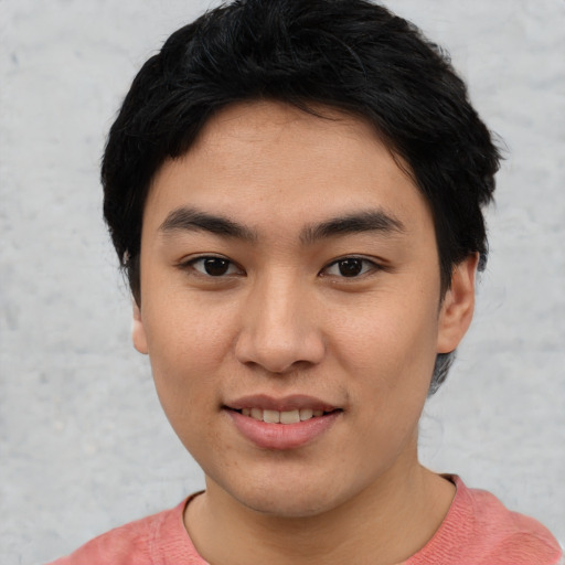 Joyful asian young-adult female with short  black hair and brown eyes