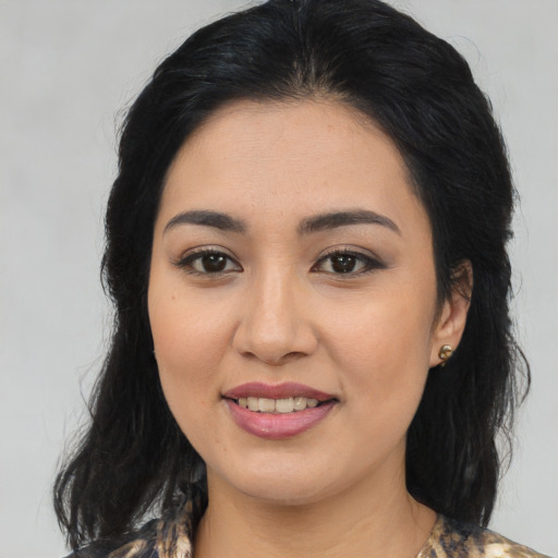 Joyful asian young-adult female with medium  brown hair and brown eyes