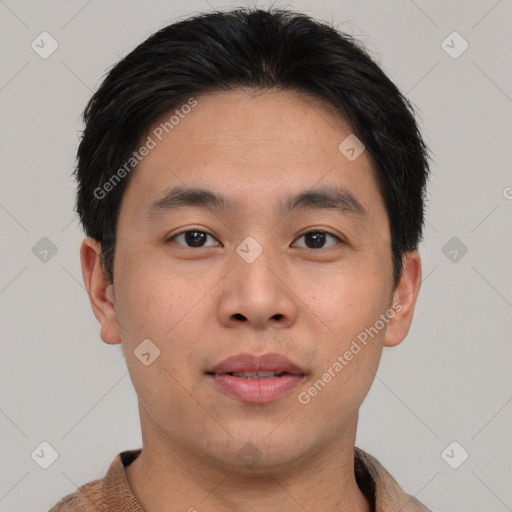 Joyful asian young-adult male with short  black hair and brown eyes