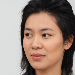 Joyful asian young-adult female with long  brown hair and brown eyes