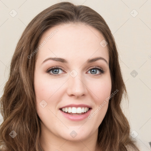 Joyful white young-adult female with long  brown hair and green eyes