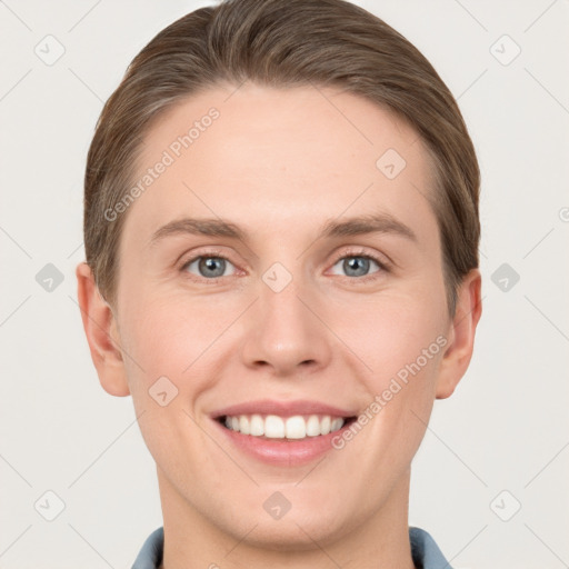 Joyful white young-adult female with short  brown hair and grey eyes