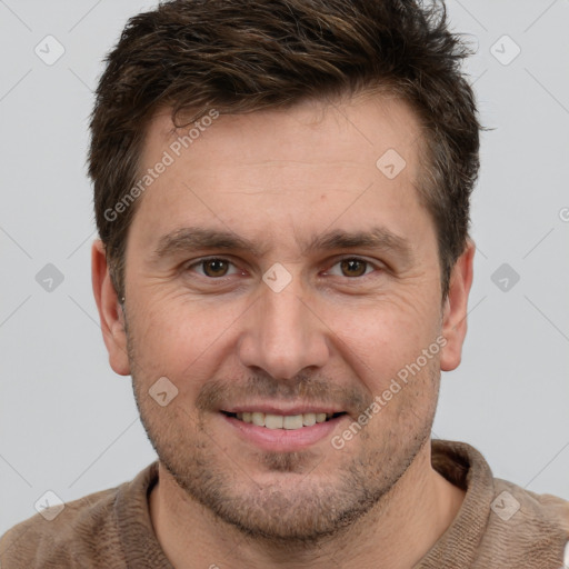 Joyful white adult male with short  brown hair and brown eyes