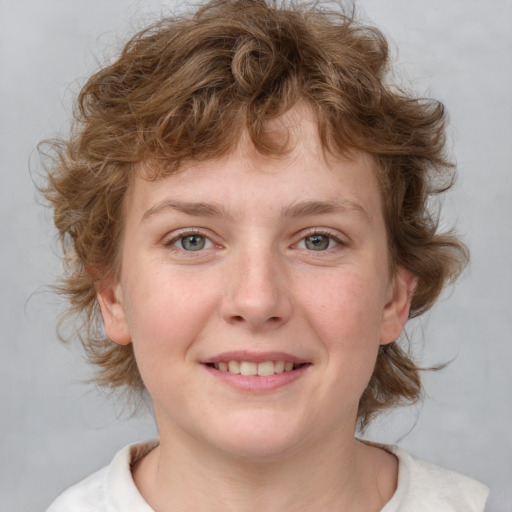 Joyful white young-adult female with medium  brown hair and blue eyes