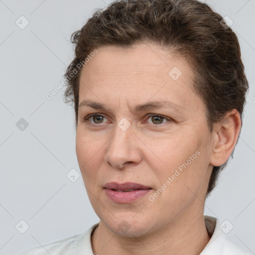 Joyful white adult female with short  brown hair and brown eyes