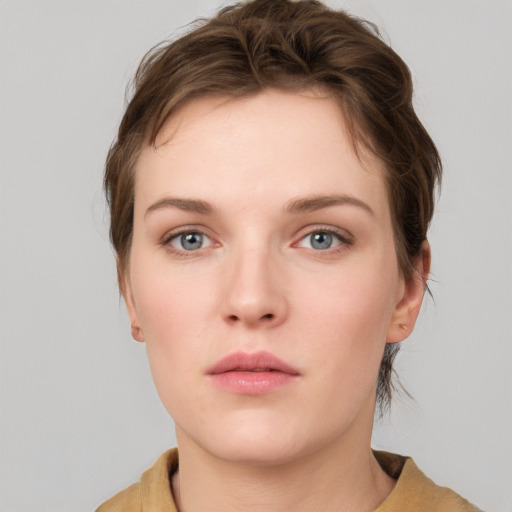 Neutral white young-adult female with short  brown hair and grey eyes