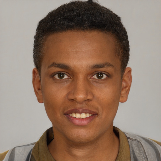 Joyful black young-adult male with short  brown hair and brown eyes
