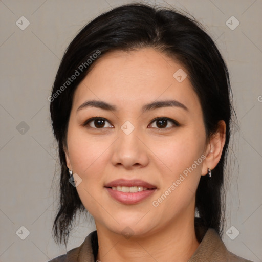 Joyful asian young-adult female with medium  black hair and brown eyes