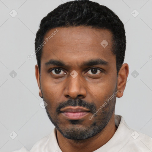 Neutral black young-adult male with short  black hair and brown eyes