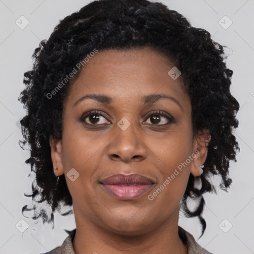 Joyful black young-adult female with medium  brown hair and brown eyes