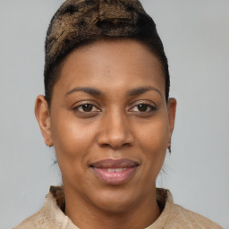 Joyful black young-adult female with short  brown hair and brown eyes