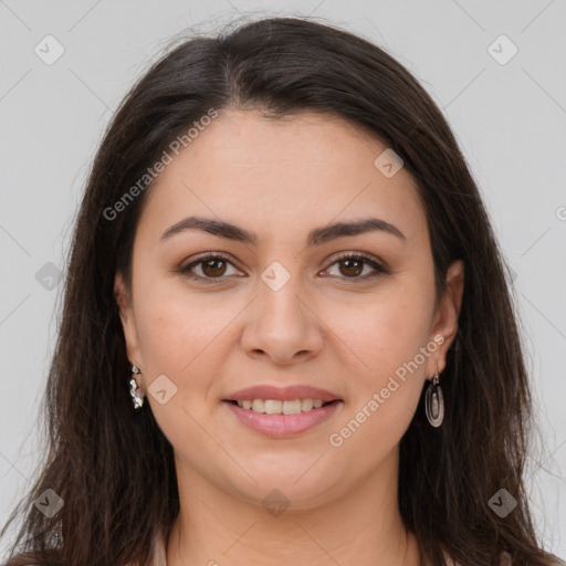 Joyful white young-adult female with long  brown hair and brown eyes