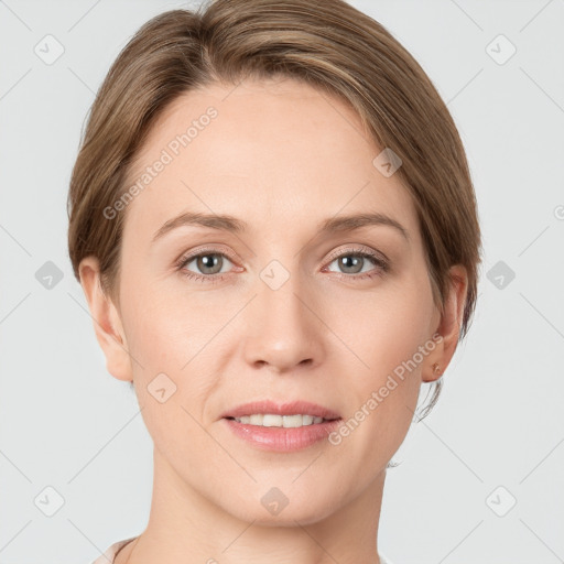 Joyful white young-adult female with short  brown hair and grey eyes