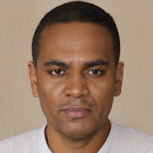 Neutral black young-adult male with short  black hair and brown eyes
