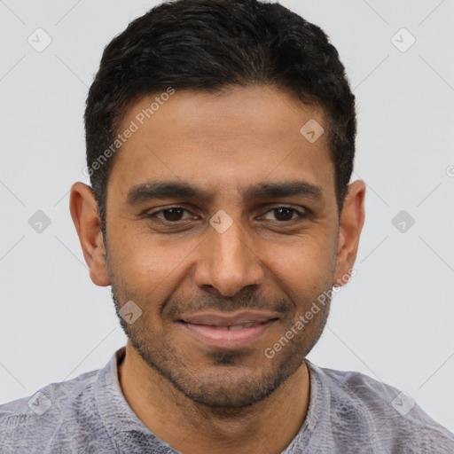 Joyful latino young-adult male with short  brown hair and brown eyes