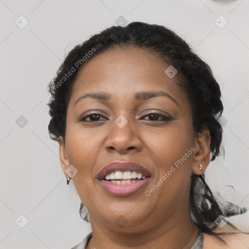 Joyful latino adult female with medium  black hair and brown eyes