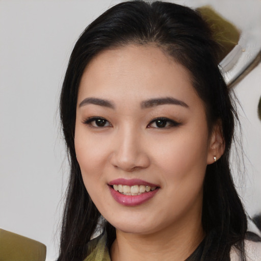 Joyful asian young-adult female with medium  black hair and brown eyes