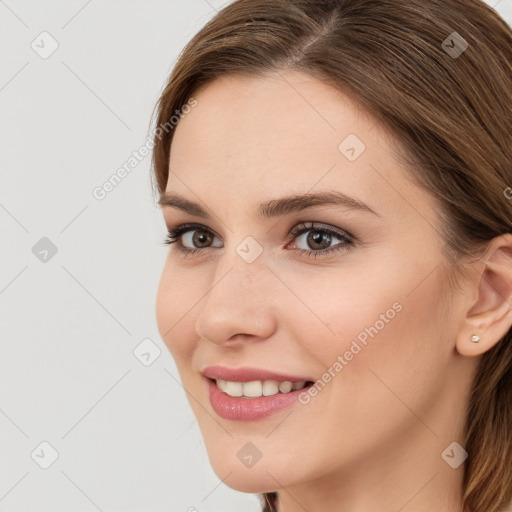 Joyful white young-adult female with long  brown hair and grey eyes