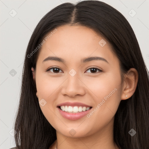 Joyful asian young-adult female with long  brown hair and brown eyes