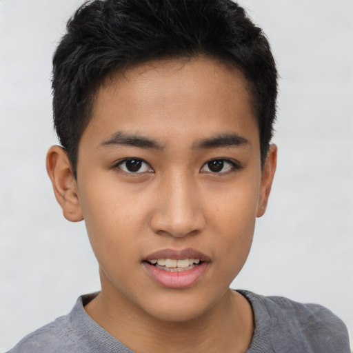 Joyful latino young-adult male with short  brown hair and brown eyes