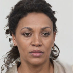 Joyful black adult female with short  brown hair and brown eyes