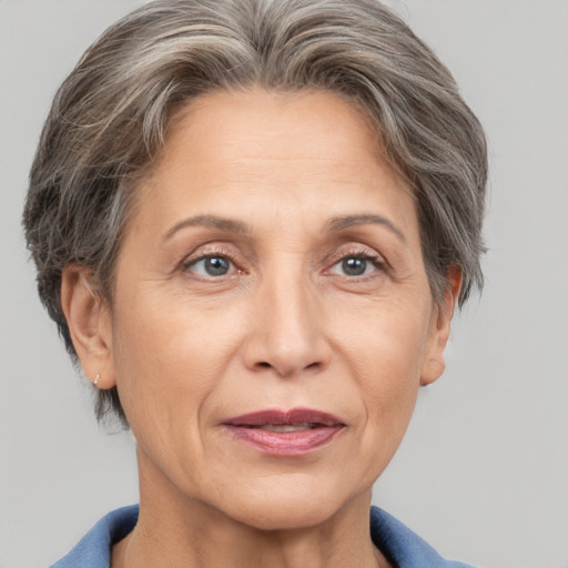 Joyful white middle-aged female with short  brown hair and grey eyes