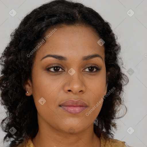 Joyful black young-adult female with long  brown hair and brown eyes