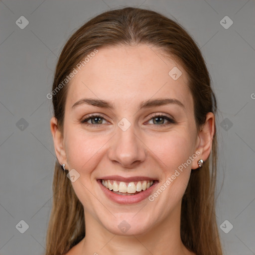 Joyful white young-adult female with long  brown hair and grey eyes